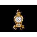 A THIRD QUARTER 19TH CENTURY FRENCH GILT BRONZE AND PORCELAIN MOUNTED MANTEL CLOCK the waisted