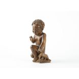 AN USUAL GERMAN, UPPER RHINE CARVED LIMEWOOD FIGURE OF THE CHRIST CHILD WITH A BIRD, PROBABLY