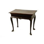 A GEORGE II IRISH MAHOGANY SIDE TABLE  with cabriole legs with scallop shell tops and pointed hoof