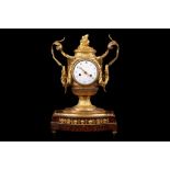 A FINE EARLY 19TH CENTURY FRENCH EMPIRE PERIOD GILT BRONZE MANTEL CLOCK BY GASTON JOLLY the case