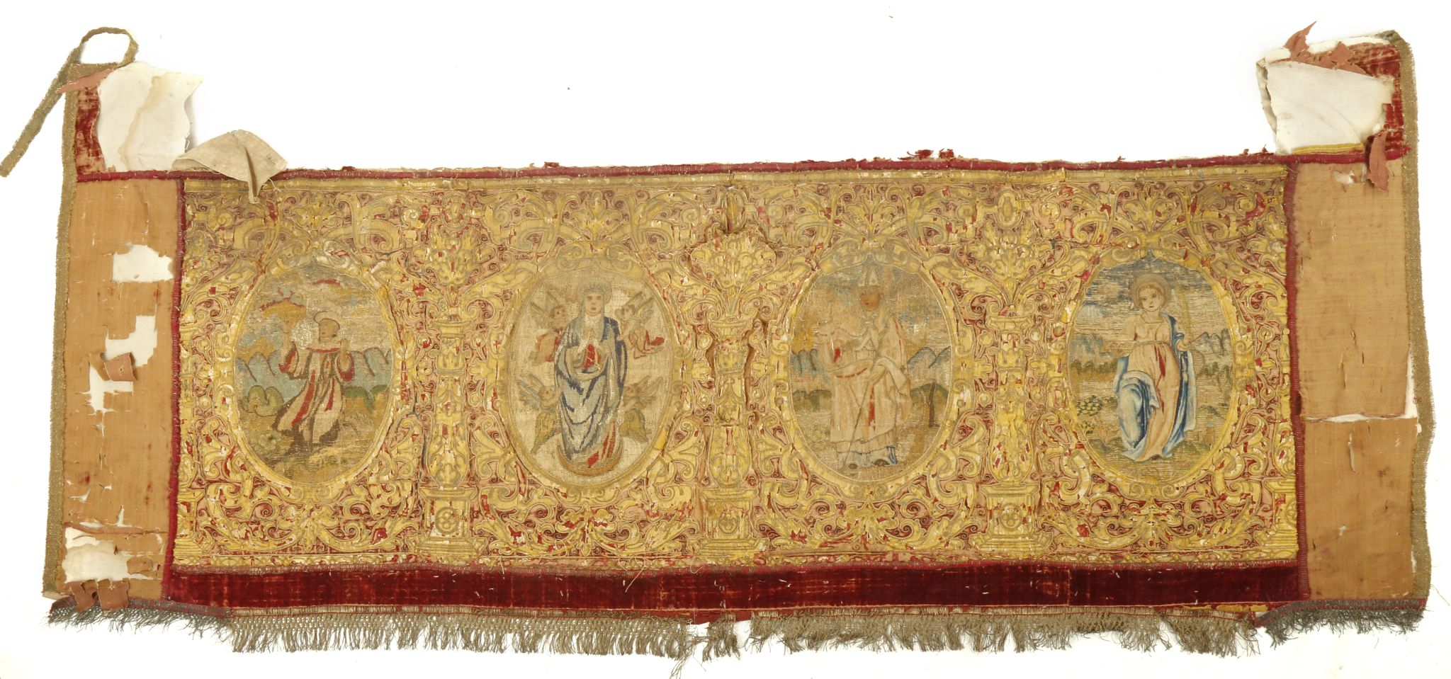 A 16TH / 17TH CENTURY RED VELVET ALTAR CLOTH EMBROIDERED WITH COLOURED SILKS AND SILVER THREAD