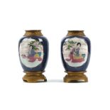 A PAIR OF FRENCH CERAMIC AND GILT BRONZE MOUNTED CHINESE STYLE VASES of baluster form, decorated