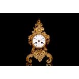 A MID 19TH CENTURY FRENCH GILT BRONZE MANTEL CLOCK BY STAUFFER, PARIS in the Rococo Revival style,