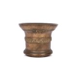 A LARGE BRONZE MORTAR, POSSIBLY 17TH CENTURY with everted lip over central band of scrolling