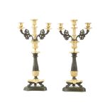 A PAIR OF GILT AND PATINATED BRONZE REGENCY CANDELABRA  each with an acanthus cast, baluster stem