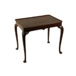 A GEORGE II MAHOGANY SILVER TABLE the dished tray top with re-entrant cut corners on well shaped