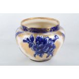 An Edwardian Royal Doulton porcelain Art Pottery jardiniere, painted with blue lustre iris flower