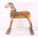 A 19th Century naive toy wooden horse, 58cm high x 53cm long.