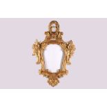 A giltwood cartouche form mirror frame, having foliate openwork pediment, 96cm high.