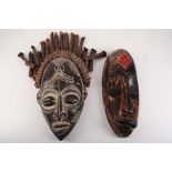 Two African wooden masks, 35-39cm high.