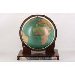 A 12 inch standard globe by Replogle Globes Inc. of Chicago, mounted onto a wooden based, with
