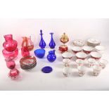A mixed selection of porcelain and coloured glass, including a Dresden 6 piece tea set, one late