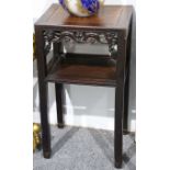 A small Chinese hardwood occasional table, with carved apron and including a lower shelf, 43 x 32.