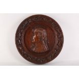 A carved wooden memorial portrait plaque of Nelson, made from original timbers from The Victory,