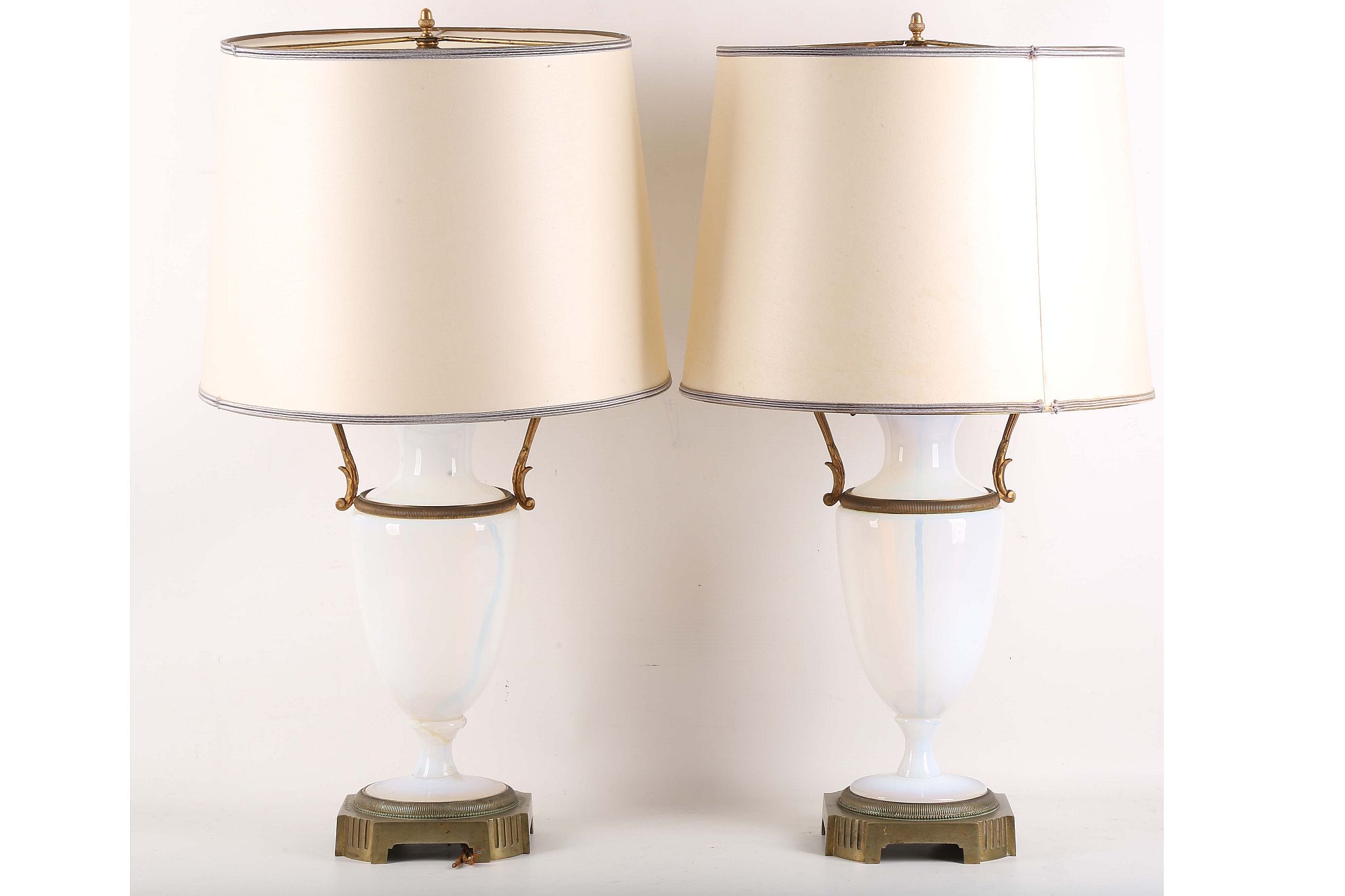 A pair of late 19th / early 20th Century Vaseline vase lamps with gilt fittings, including bases (