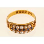 An antique gold, sapphire and half seed pearl ring, 1898, The lines of circular-cut sapphires and