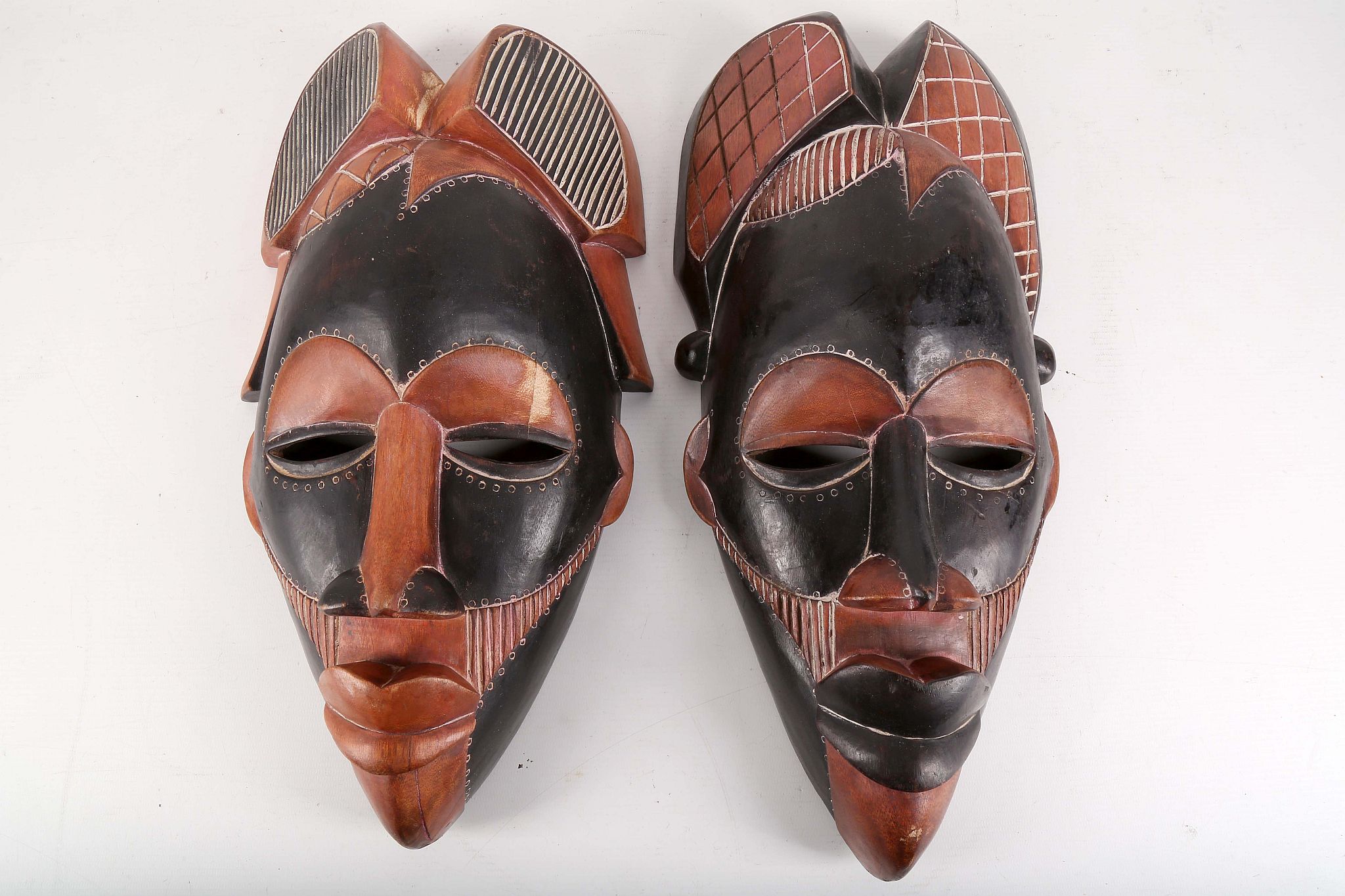 Two Punu masks, Gabon, 40-44cm high (2).