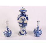 A pair of Chinese blue and white 19th Century narrow necked vases, sold together with a slender