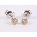 A pair of diamond earstuds, Each collet-set brilliant-cut diamond, diamonds approx. 0.10ct total,