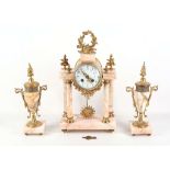 A 20th Century French gilt metal marble clock garniture in 'Empire' style, with pendulum and key,