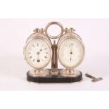 A silver plated desk clock and barometer, mounted onto a single marble base, and having a central