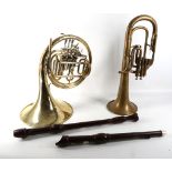 A 20th Century brass French horn, sold with a trumpet and two Dolmetsch Dolomite Tenor recorders, (