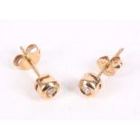 A pair of gold and diamond earstuds, Each collet-set brilliant-cut diamond, mounted in 9 carat