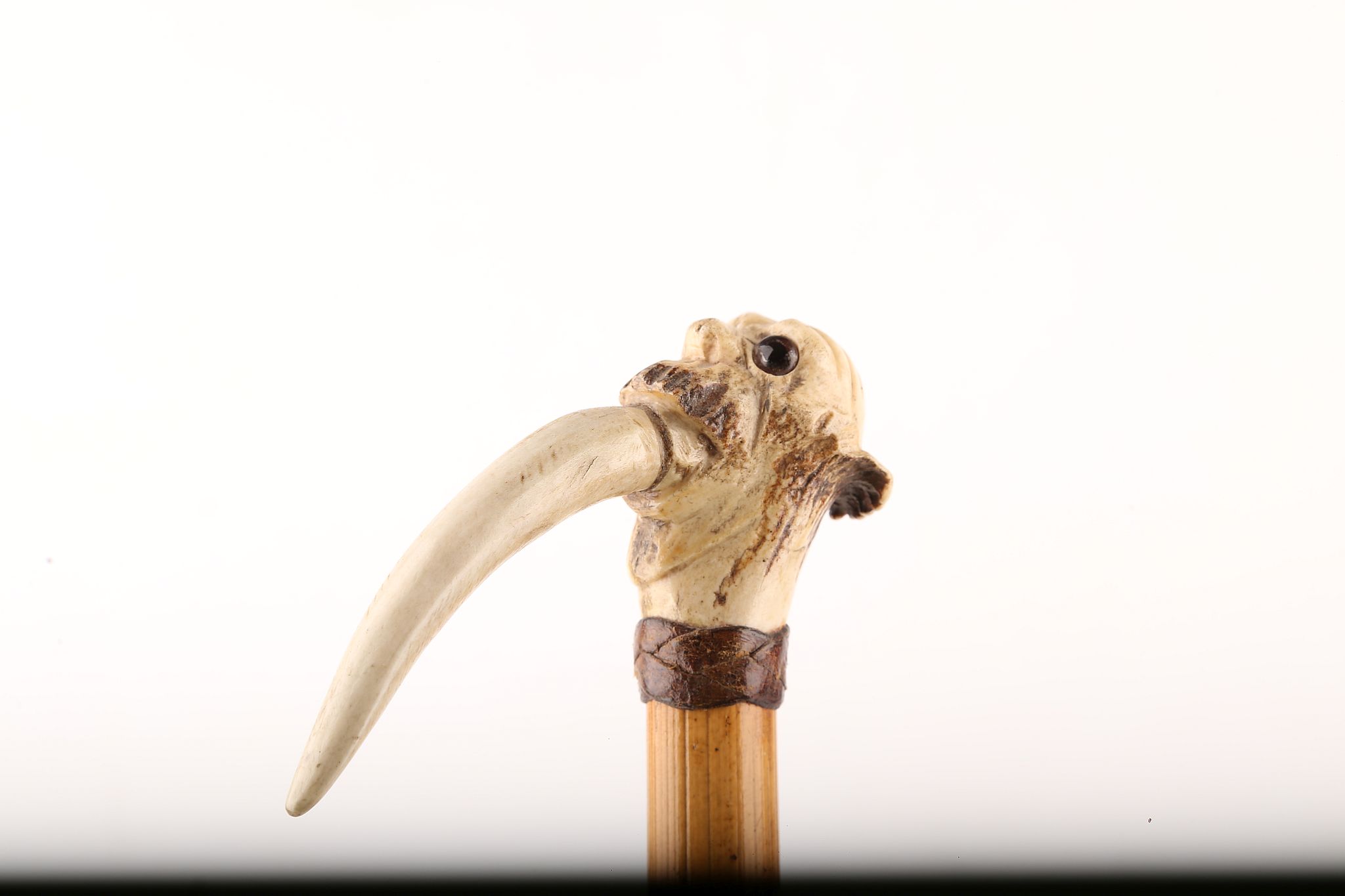 A STAG ANTLER HANDLED CANE, on an ebonised hardwood shaft, 92cm.