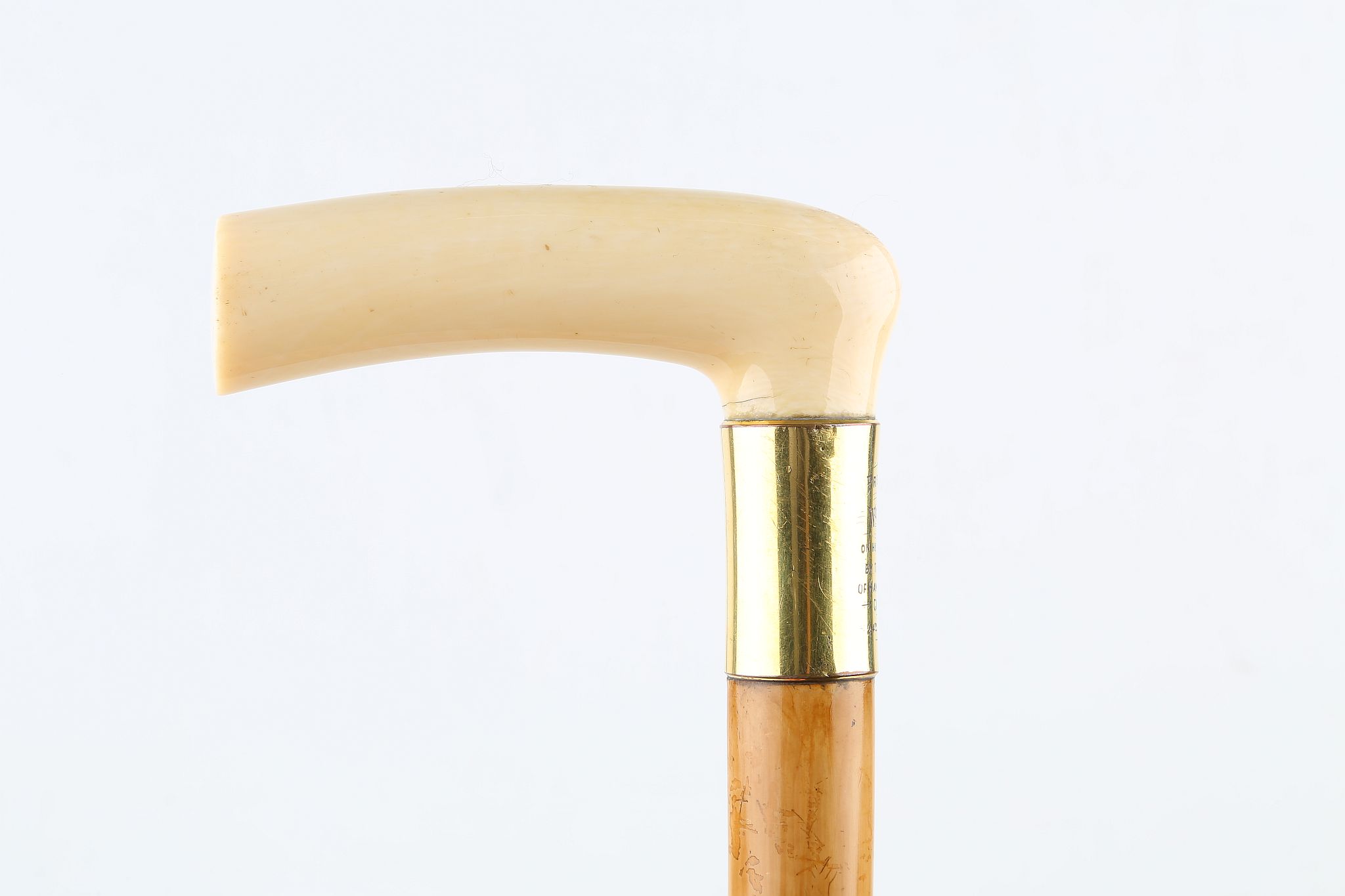 AN IVORY HANDLED PRESENTATION CANE, DATED 1903, with gilt collar and malacca shaft, 36 inches (