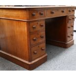 A Victorian oak twin pedestal desk, having 3 frieze drawers and 3 drawers per pedestal, leather