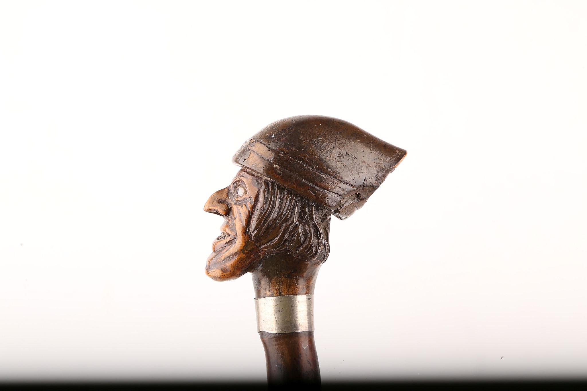 AN INTERESTING FOLK ART WOOD CANE, modelled as a man's head wearing a working hat, early glass eyes, - Image 2 of 6