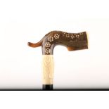 AN 'L' SHAPED HORN HANDLED CANE, with various inlays, ebony shaft, 94cm.