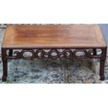 A Chinese rectangular hardwood low table, with pierced apron on shaped underframe, 76cm wide.