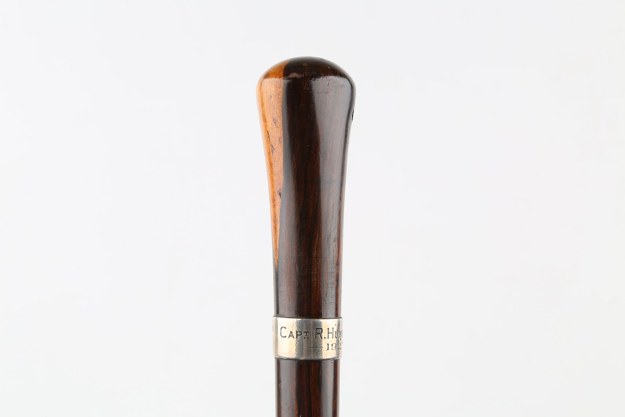 A LIGNUM VITAE CANE, with silver collar engraved 'Capt. R. Hume Brodie 1923', 36 inches (93cm).