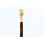 A WALKING STICK WITH MASONIC INTEREST, with ivory knop and a window in top containing a glass
