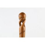 A LATE 19TH CENTURY CORFU (KEPKYPA) SOUVENIR WALKING STICK, depicting a ball in a claw, 36 inches (