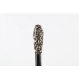 AN EBONY WALKING STICK, with Continental silver knop decorated with cherubs, 36 inches (92cm).
