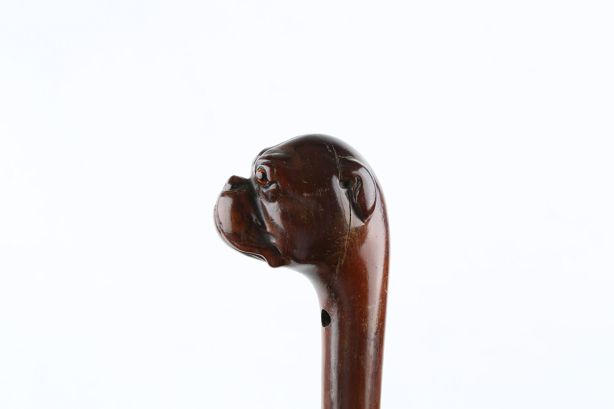 A ONE PIECE FOLK ART CANE, bulldog handle with glass eyes, 34 inches (87cm).