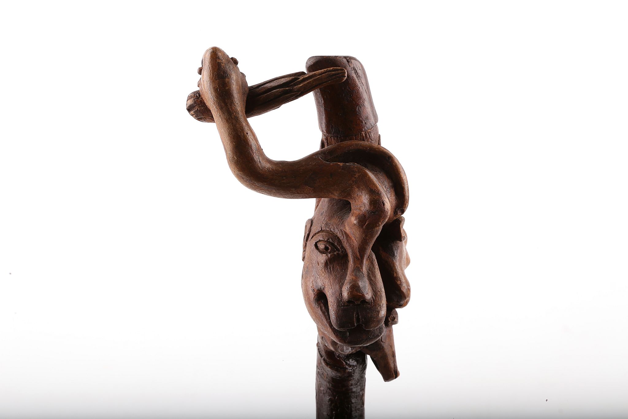 A BEAUTIFUL ONE PIECE FOLK ART CARVED FIGURAL CANE, with a man's face and various animals, 93cm.