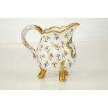 A SÈVRES PORCELAIN MILK JUG, circa 1775, pot à lait 'à trois pieds' of the second size, the front