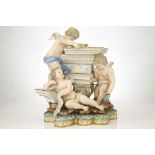 A MEISSEN PORCELAIN FIGURE GROUP EMBLEMATIC OF ARCHITECTURE, late 19th century, modelled as three