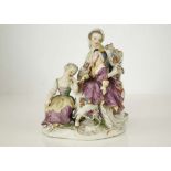 A MEISSEN PORCELAIN FIGURE GROUP, 19th century, modelled as a young lady wearing a floral dress,