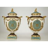 A FINE PAIR OF WEDGWOOD PORCELAIN NEOCLASSICAL VASES AND COVERS, late 19th century, both of twin-