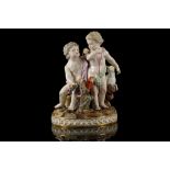 A MEISSEN PORCELAIN FIGURE GROUP OF PUTTI, circa 1870, wearing coloured sashes, one seated upon a