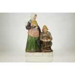 A ROYAL COPENHAGEN PORCELAIN FIGURE GROUP OF A FISHERMAN AND WOMAN, early 20th century, modelled