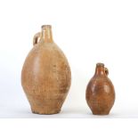 TWO GERMAN STONEWARE BELLARMINE-TYPE FLASKS OR JUGS, 17th or 18th century, probably Rhenish, of