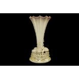 A FIRST PERIOD BELLEEK PORCELAIN CENTREPIECE, circa 1863-90, of trumpet form with a frilled rim