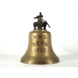 A 1942 BRASS SHIP'S BELL FROM H.M.S. Bern, annotated on bell exterior, with striker, 39.6cm high.