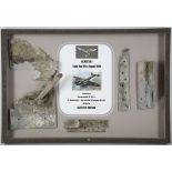 A BOX FRAMED COLLECTION OF REMNANTS OF A MESSERSCHMIDT BF-110 C-4, flown by Lieutenant Munchmeyer,