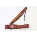 A MID 20th CENTURY LEATHER POLICE BELT AND SASH, with attached 'The Metropolitan' whistle, issued to